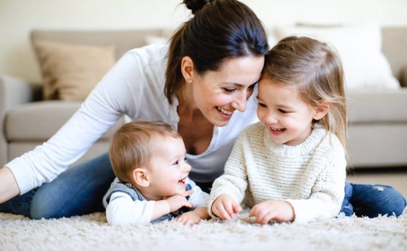 Parent and child sharing a meaningful interaction, symbolizing a nurturing environment that fosters emotional intelligence and strong family bonds.
