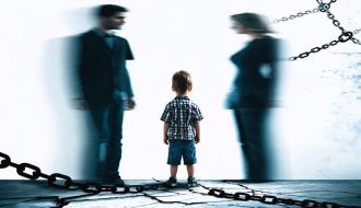 Child standing between two blurred parent figures, illustrating the emotional distress and conflict of parental alienation.